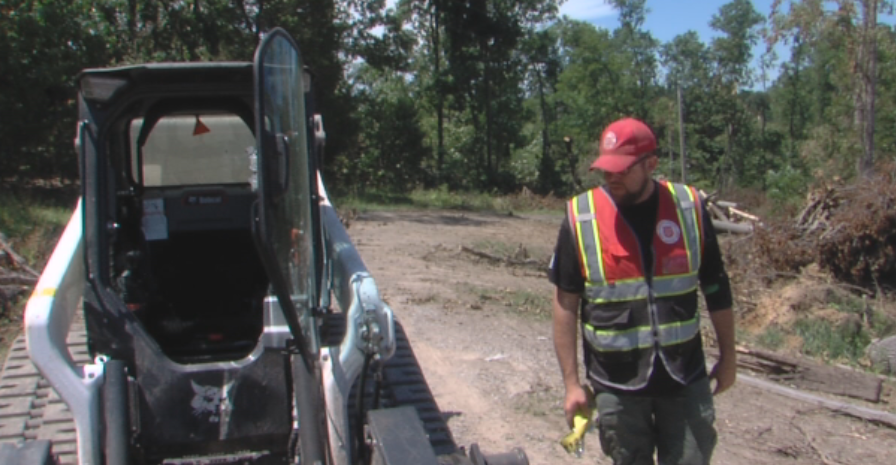 Salvation Army member cleaning up storm damage in Goreville, IL